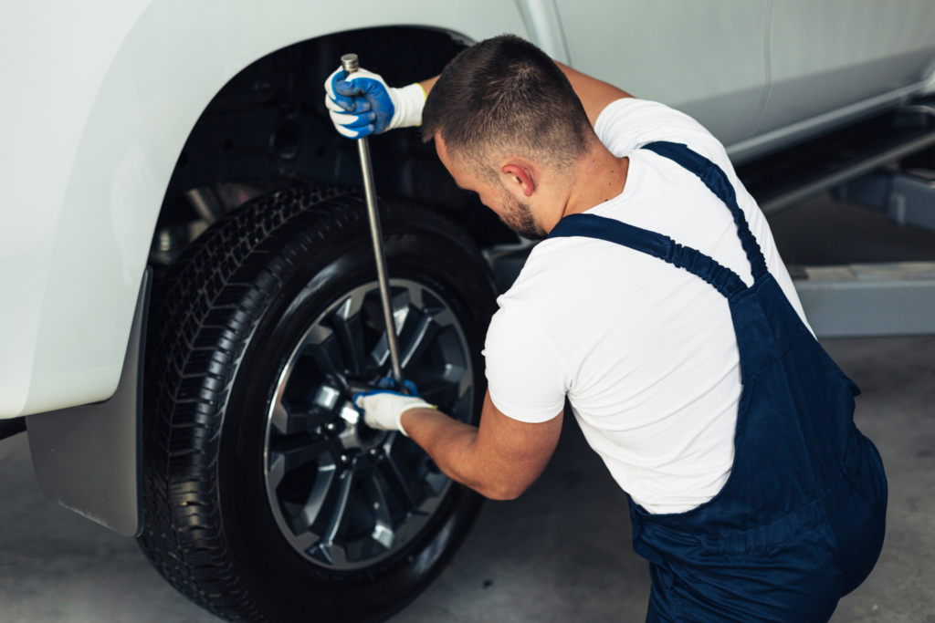Skilled technicians at New Cochin Tyres inspect and service tires on various vehicles, reflecting the commitment to quality and safety in every service provided